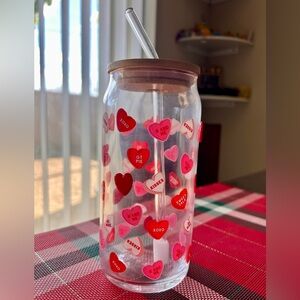 Glass tumbler with heart print and straw
